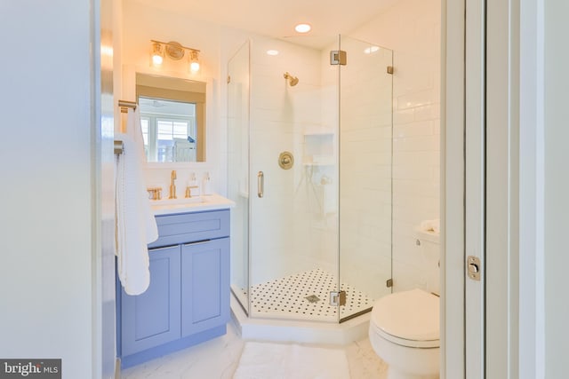 bathroom with vanity, a shower stall, toilet, and marble finish floor