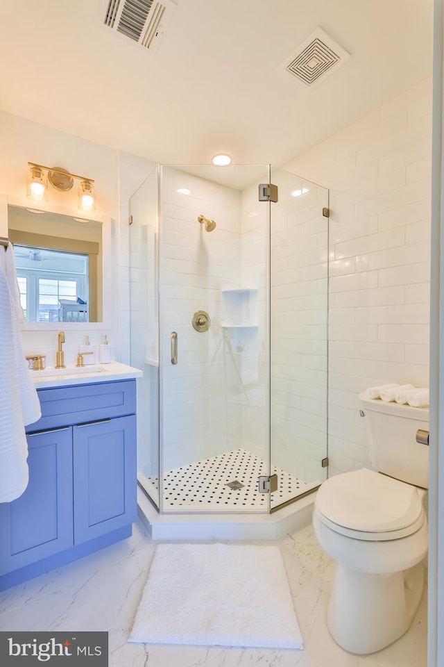 full bath featuring vanity, visible vents, marble finish floor, and a stall shower