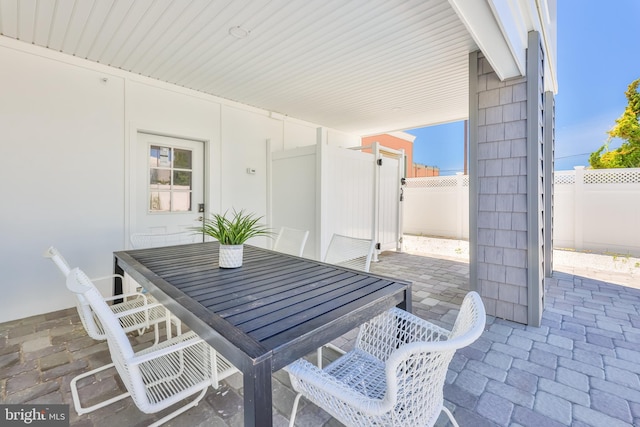 view of patio / terrace with outdoor dining space and fence