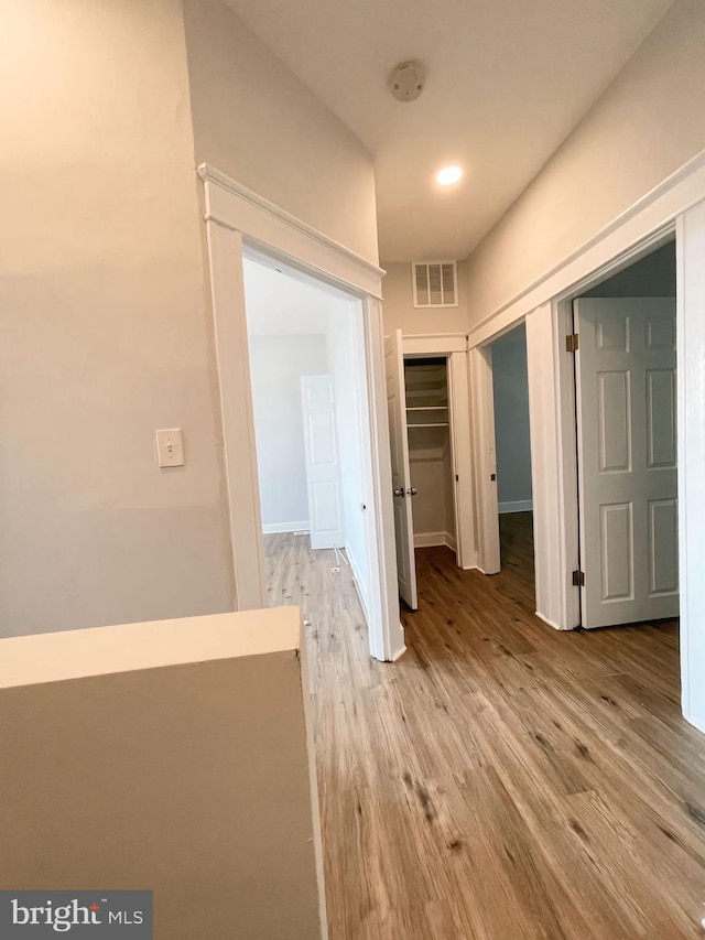 hall with light hardwood / wood-style floors