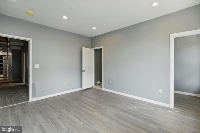 unfurnished bedroom featuring light wood-type flooring