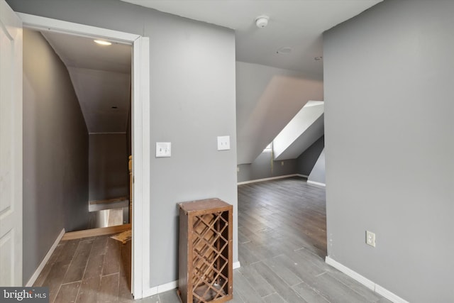 hallway with hardwood / wood-style floors