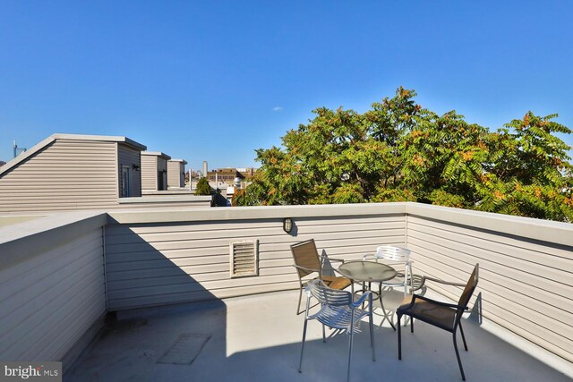 view of patio featuring a balcony