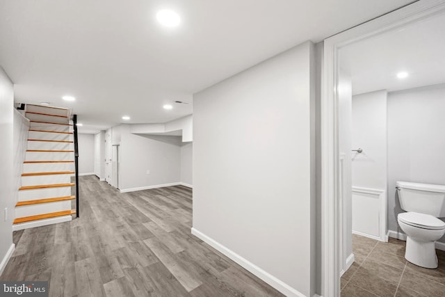 basement featuring light hardwood / wood-style flooring