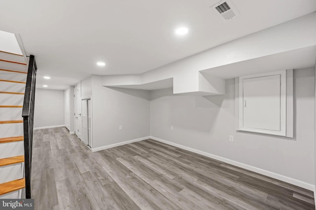 basement featuring hardwood / wood-style floors