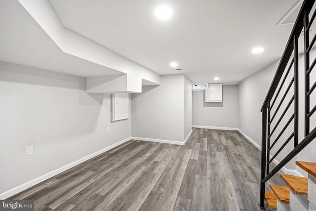 basement featuring light hardwood / wood-style floors