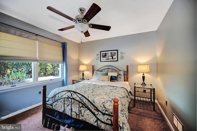 bedroom featuring dark colored carpet and ceiling fan