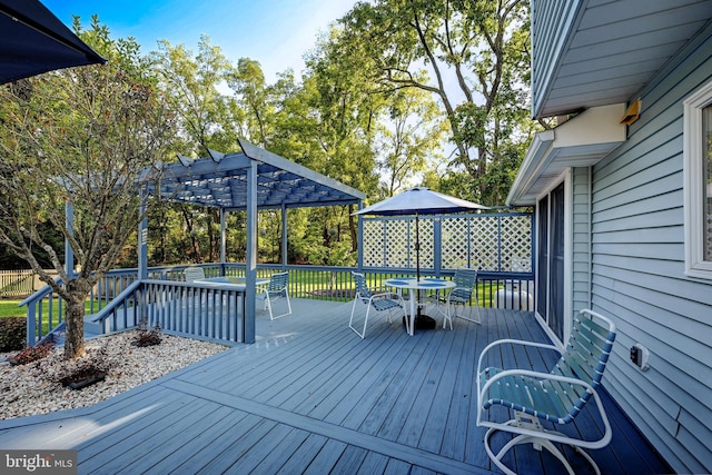 wooden terrace with a pergola