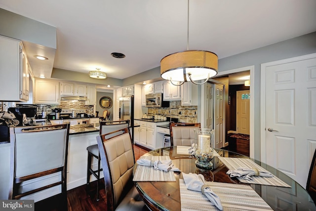 dining room featuring dark wood-type flooring