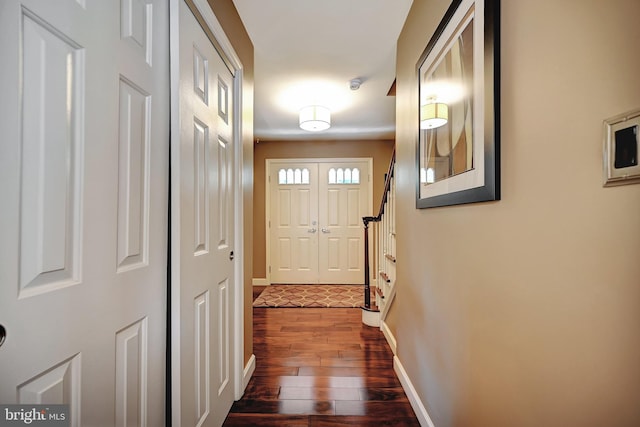 doorway with dark hardwood / wood-style floors