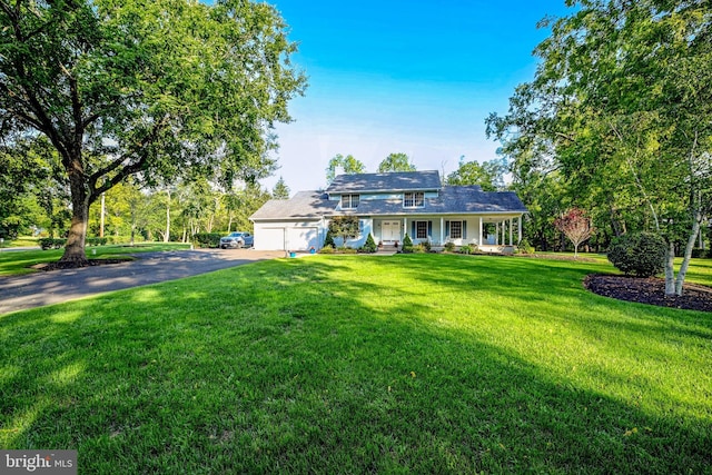 single story home with a garage and a front lawn