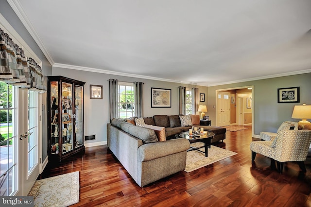 living room featuring dark hardwood / wood-style floors and crown molding