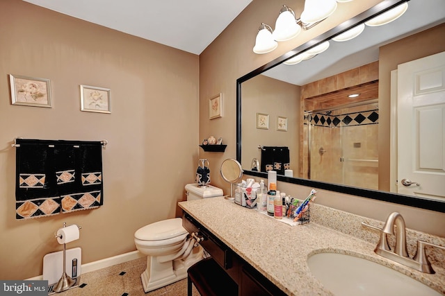 bathroom featuring walk in shower, vanity, and toilet