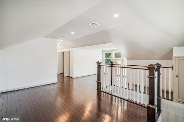 bonus room featuring lofted ceiling and dark wood-type flooring