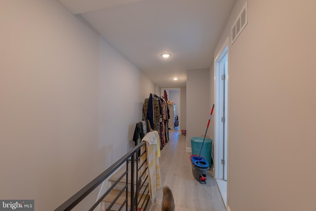 corridor with light wood-type flooring