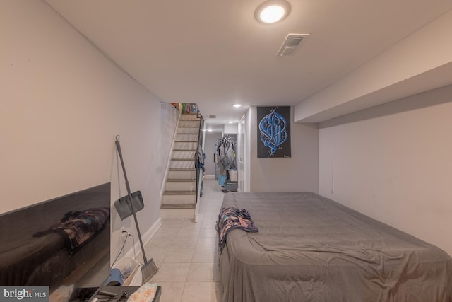 bedroom featuring light tile patterned flooring