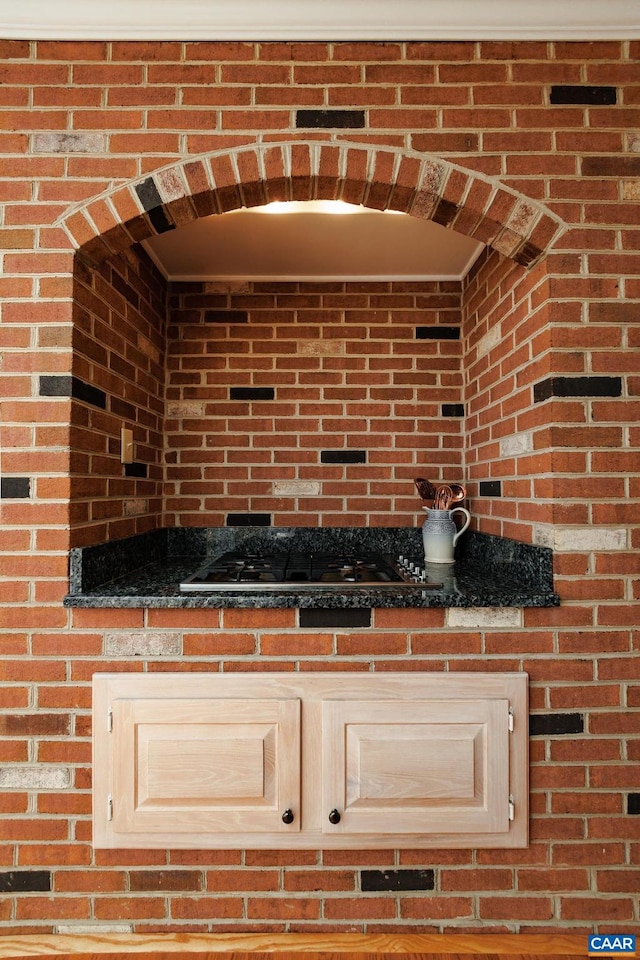 interior space with stainless steel gas stovetop