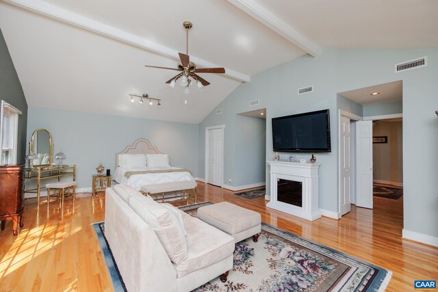 carpeted bedroom with a paneled ceiling