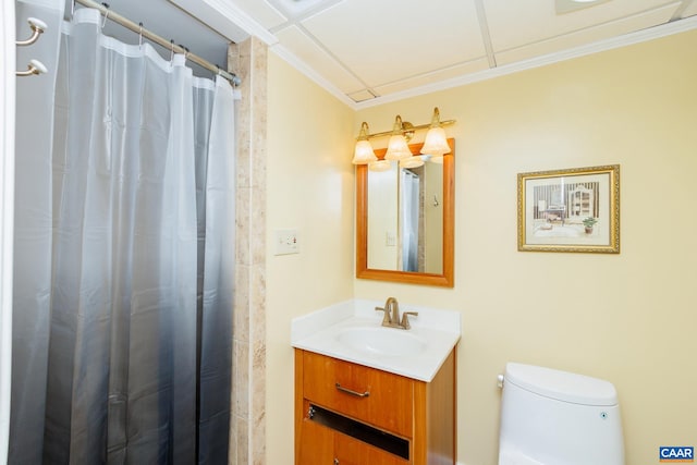 bathroom featuring vanity, toilet, ornamental molding, and curtained shower