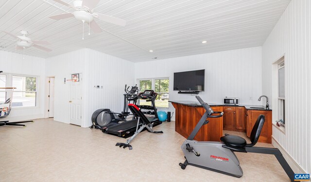 exercise area with ceiling fan and sink