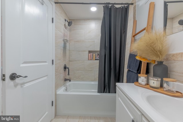 bathroom featuring vanity and shower / tub combo