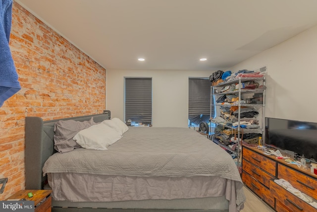 bedroom with brick wall