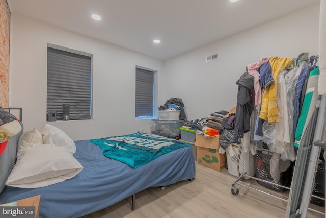 bedroom with wood-type flooring