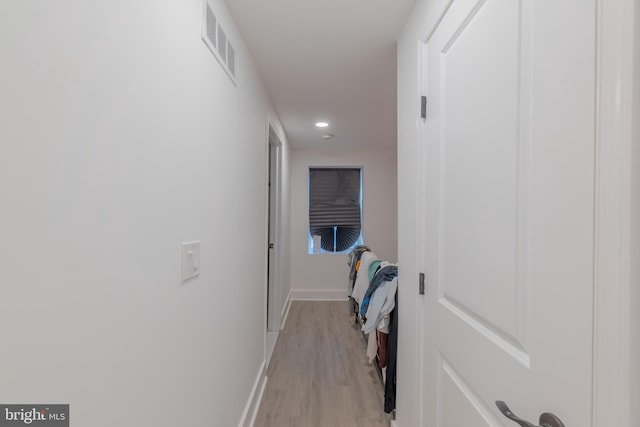 hallway with light wood-type flooring