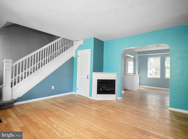 unfurnished living room with light hardwood / wood-style floors