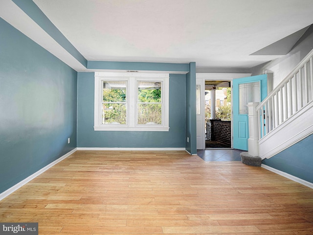 foyer entrance featuring light wood-type flooring and a wealth of natural light