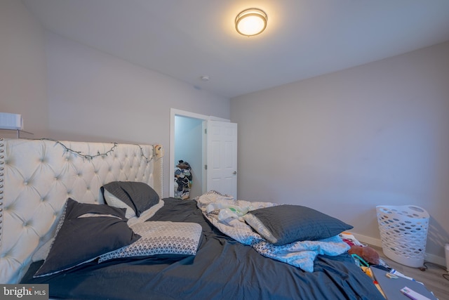 bedroom with hardwood / wood-style floors