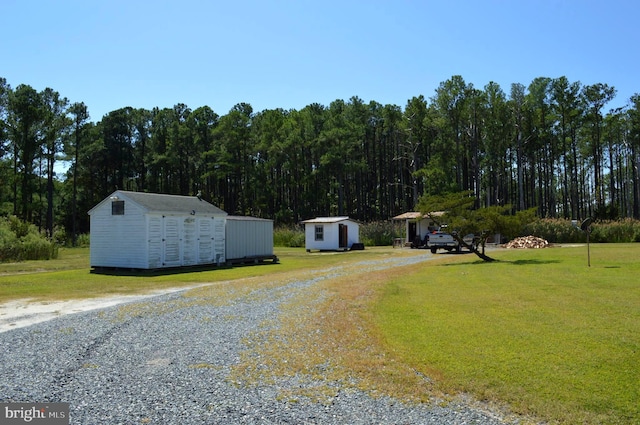 view of front facade with a front lawn and a shed