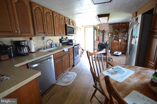 kitchen featuring light wood-type flooring, sink, and appliances with stainless steel finishes