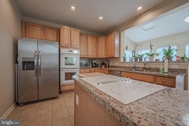 kitchen with stainless steel fridge with ice dispenser, sink, vaulted ceiling, light tile patterned floors, and double oven