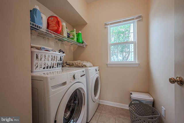 laundry area with light tile patterned flooring and independent washer and dryer