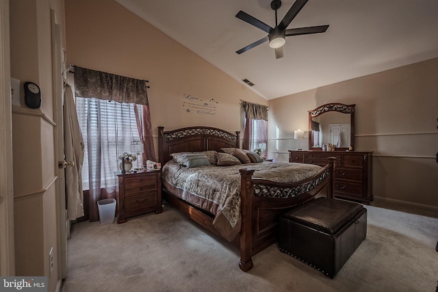 carpeted bedroom featuring ceiling fan and high vaulted ceiling