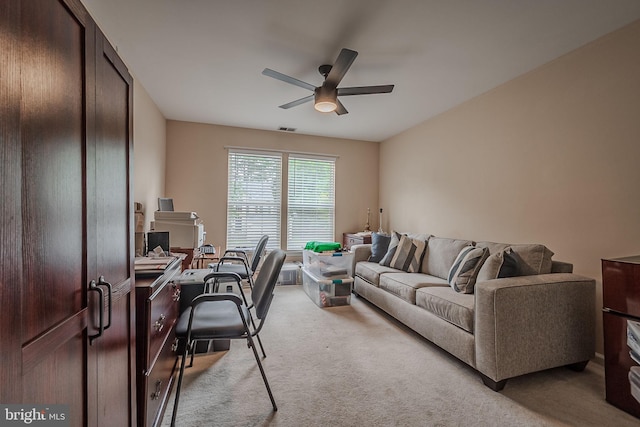 carpeted office featuring ceiling fan