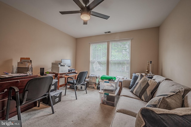 carpeted home office with ceiling fan