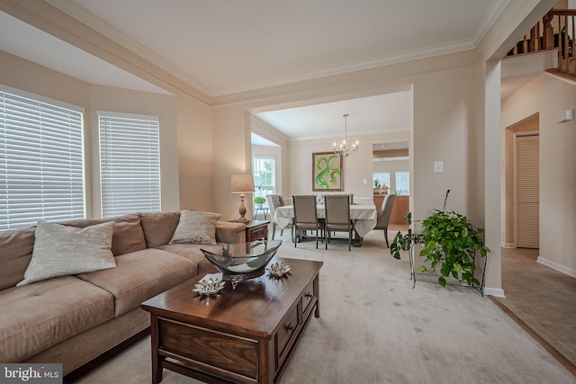 carpeted living room featuring a chandelier and crown molding