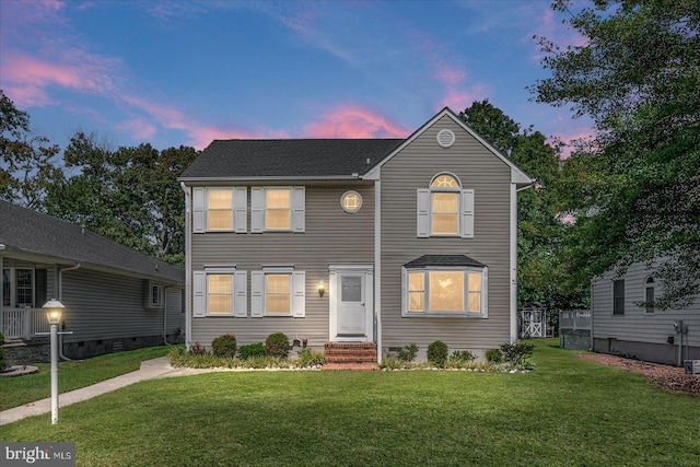 view of front of home with a lawn