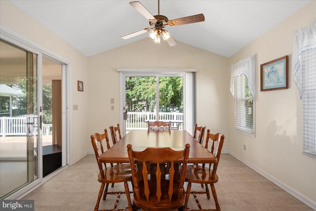 dining area with ceiling fan and lofted ceiling