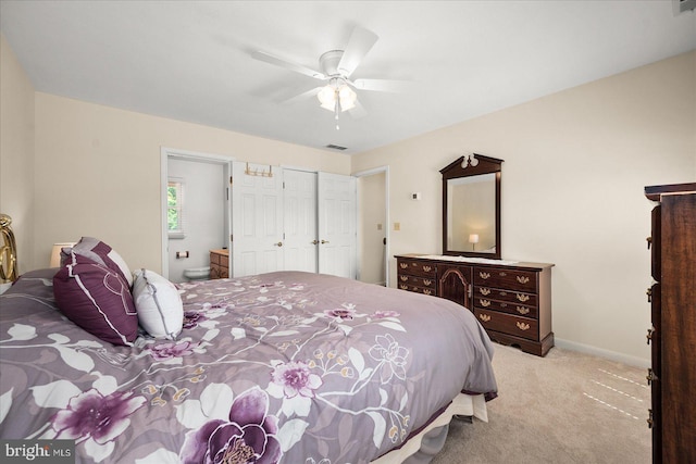 carpeted bedroom with ceiling fan and ensuite bathroom