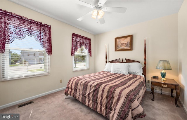 bedroom with ceiling fan and light colored carpet