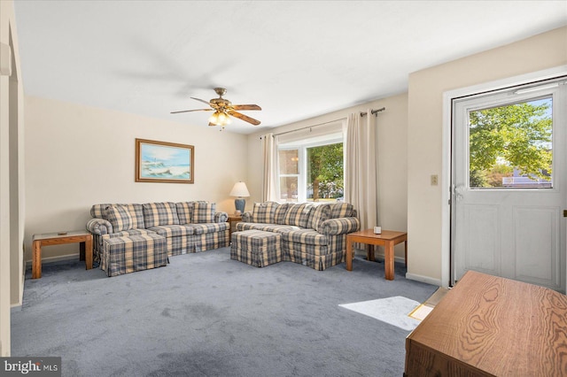 living room featuring carpet floors and ceiling fan