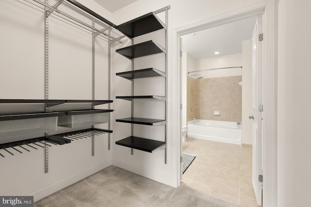 walk in closet featuring light tile patterned floors