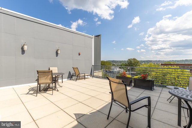 view of patio featuring a balcony