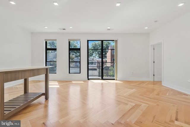 spare room featuring light parquet flooring