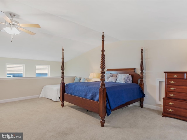 carpeted bedroom featuring vaulted ceiling and ceiling fan