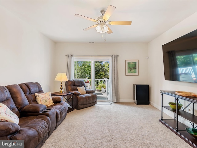 living room featuring light carpet and ceiling fan