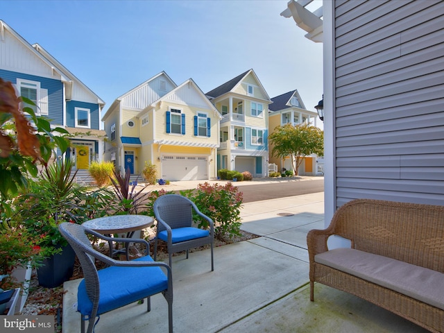 view of patio / terrace featuring a garage